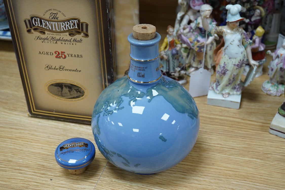 A boxed bottle of Glenturret single highland malt whisky, housed in a globe decanter